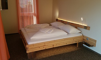 One of a 3 cosy double rooms in total - natural style, with plenty of wood
